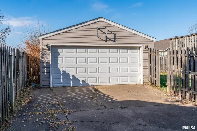 a front view of a house with a garage