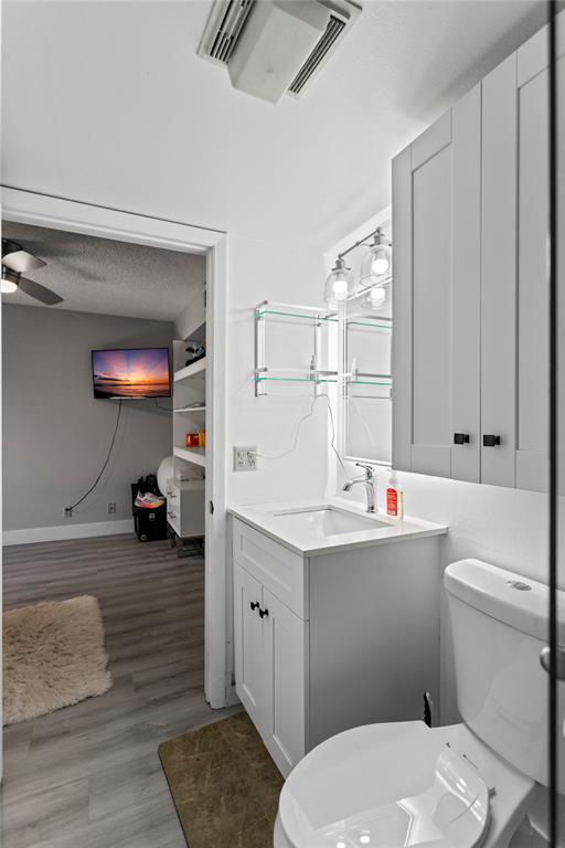 22940 Oxford Place, Unit C Boca Raton, FL 33433 - Photo 20 of 60 a bathroom with a sink toilet vanity and tub