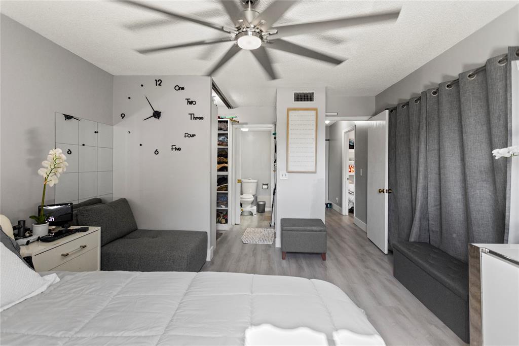 22940 Oxford Place, Unit C Boca Raton, FL 33433 - Photo 26 of 60 a living room with lots of furniture and a wooden floor