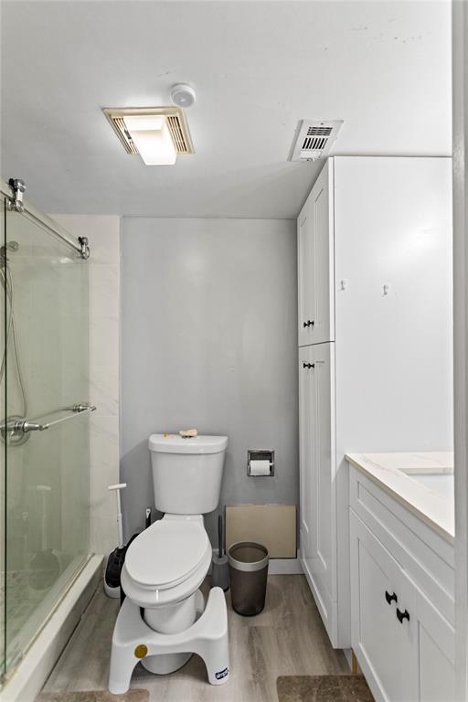 22940 Oxford Place, Unit C Boca Raton, FL 33433 - Photo 30 of 60 a bathroom with a toilet and a shower