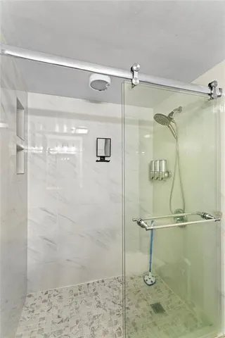 a bathroom with a tub sink and a mirror
