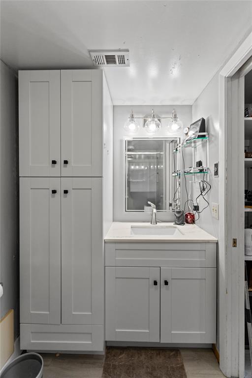 22940 Oxford Place, Unit C Boca Raton, FL 33433 - Photo 33 of 60 a view of cabinets and window