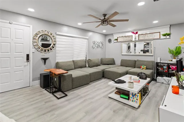 a living room with furniture and a window