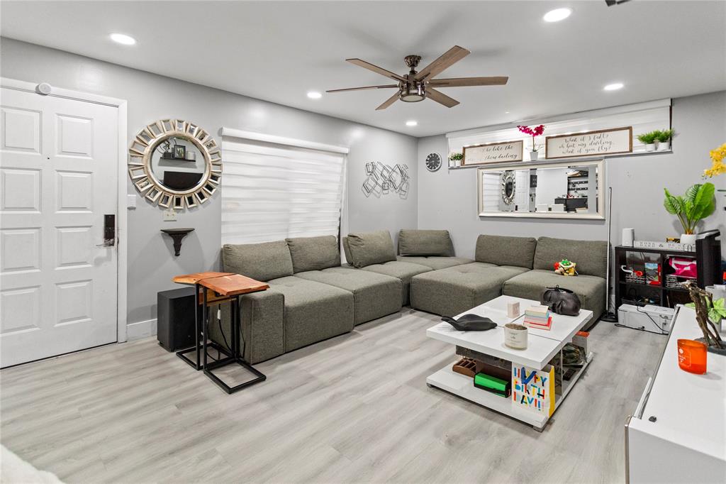 22940 Oxford Place, Unit C Boca Raton, FL 33433 - Photo 9 of 60 a living room with furniture and a wooden floor