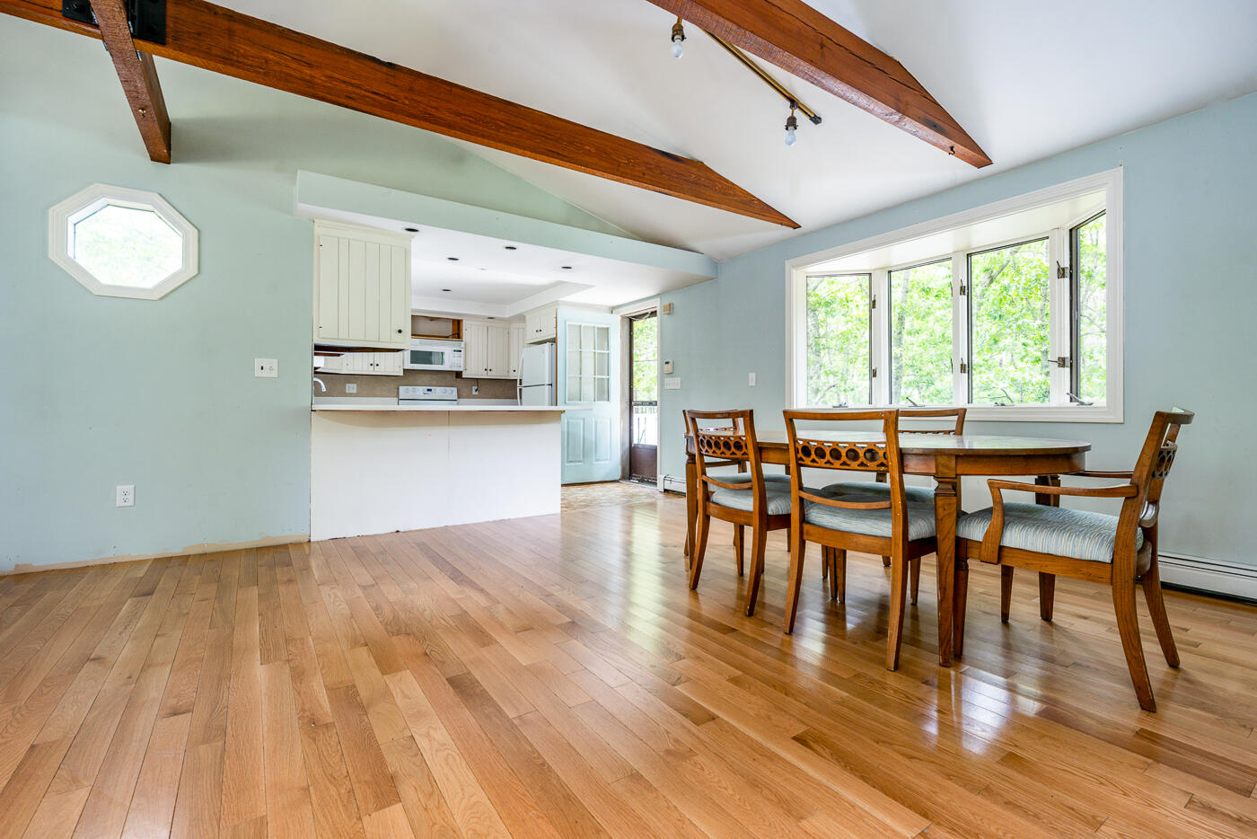 115 Pine Needle Road Wellfleet, MA 02667 - Photo 11 of 37 a view of a dining room with furniture and wooden floor