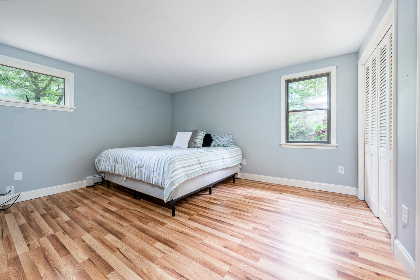 115 Pine Needle Road Wellfleet, MA 02667 - Photo 17 of 37 a bedroom with a bed and wooden floor