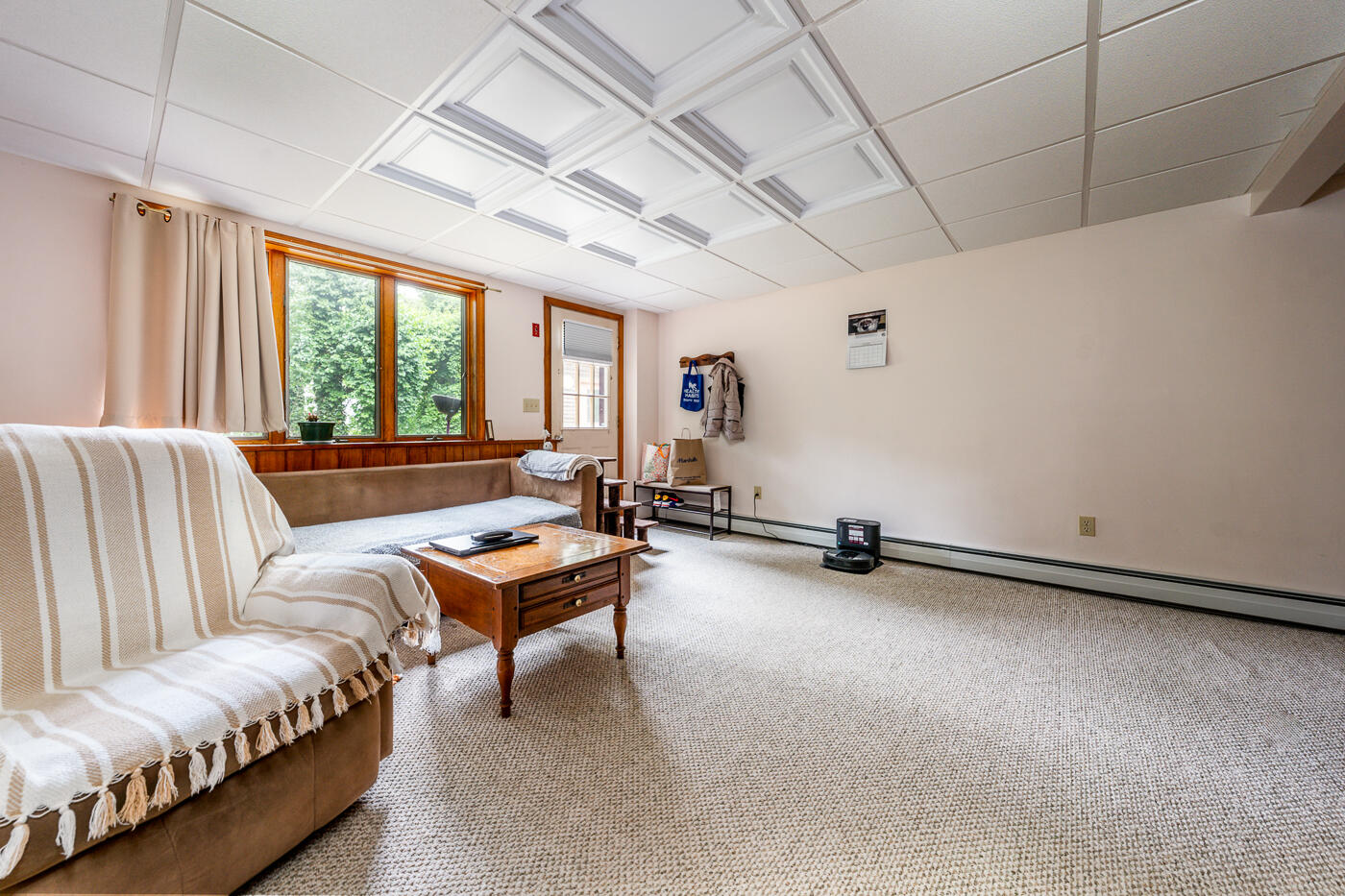 115 Pine Needle Road Wellfleet, MA 02667 - Photo 26 of 37 a living room with furniture a ceiling fan and a window