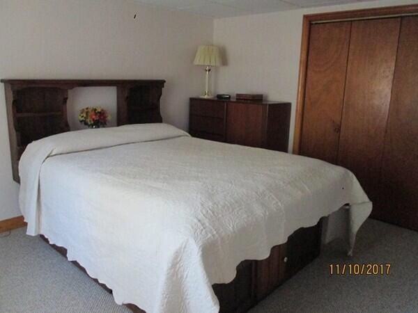 115 Pine Needle Road Wellfleet, MA 02667 - Photo 28 of 37 a bedroom with a bed and a table