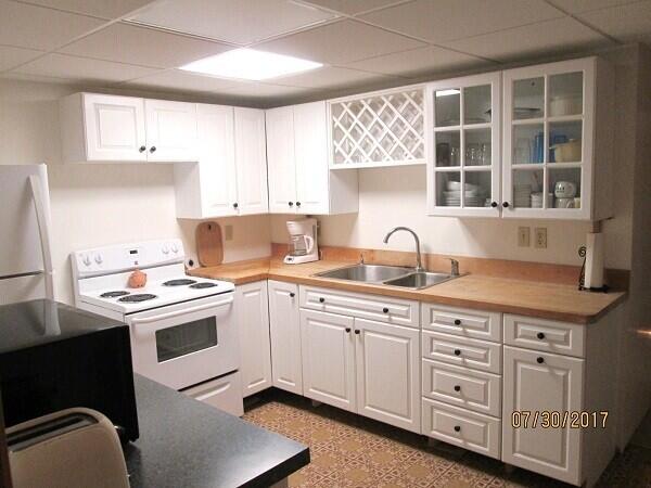 115 Pine Needle Road Wellfleet, MA 02667 - Photo 29 of 37 a white kitchen with sink and window