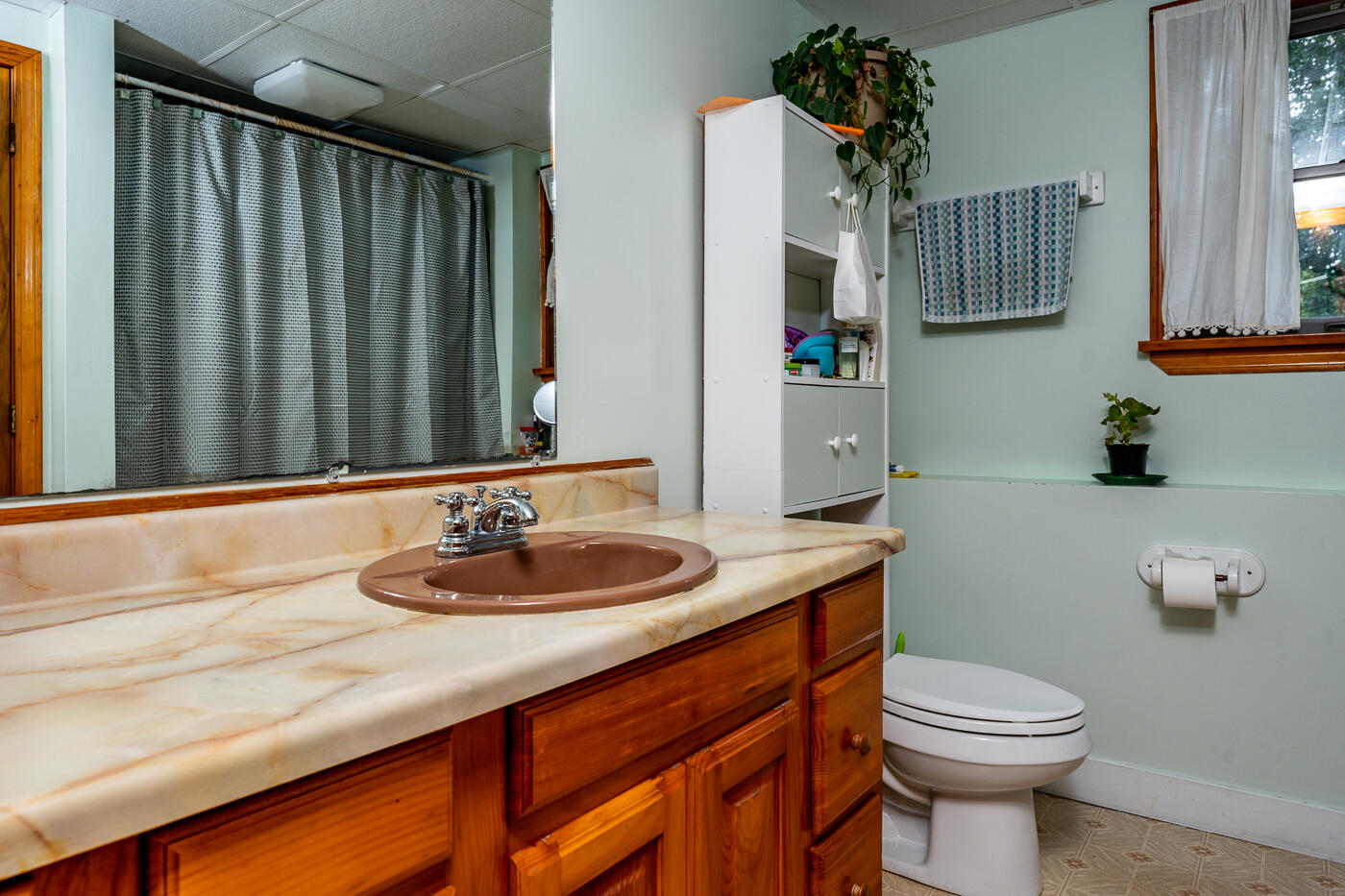 115 Pine Needle Road Wellfleet, MA 02667 - Photo 30 of 37 a bathroom with a granite countertop sink and a mirror