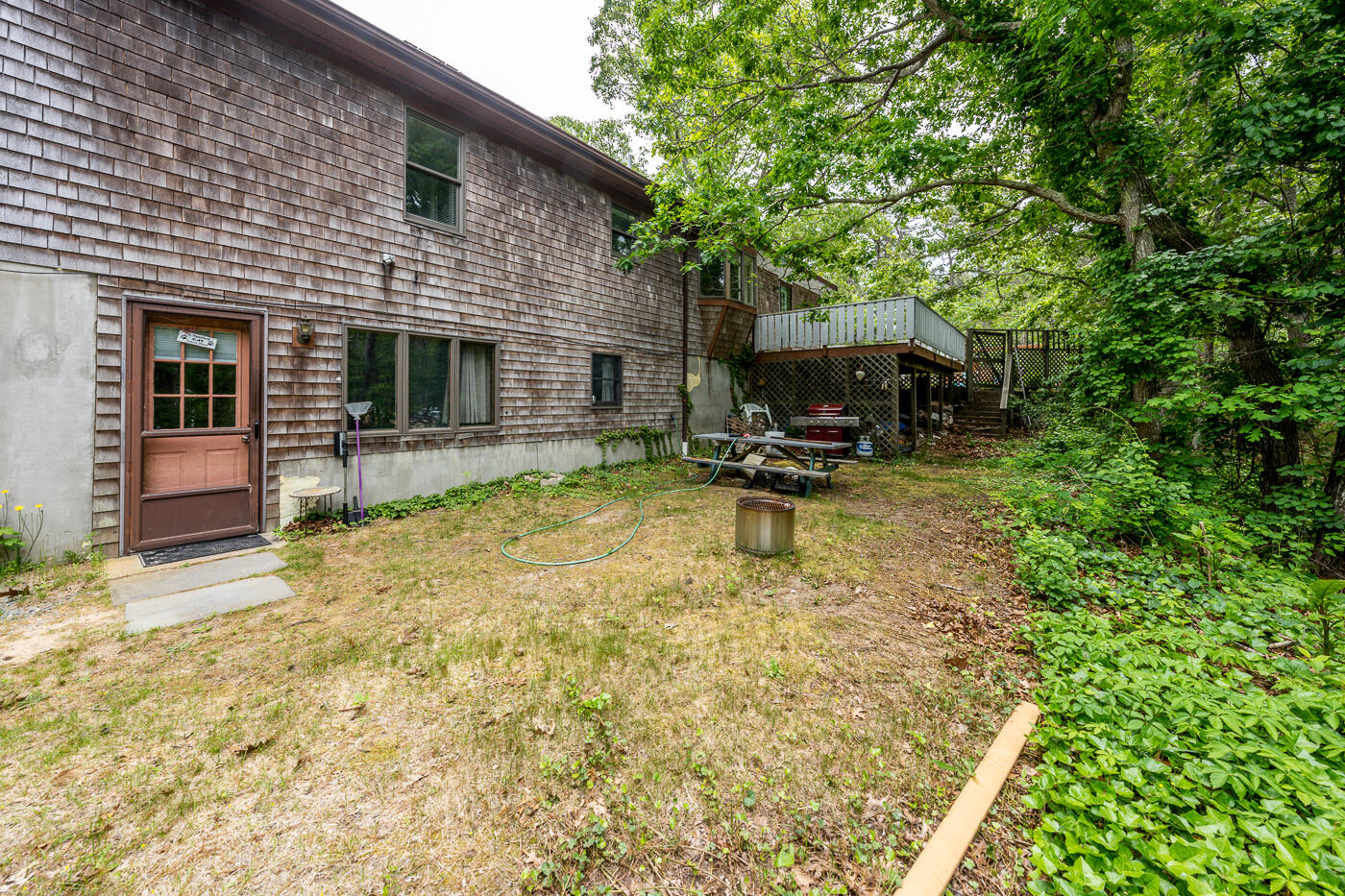 115 Pine Needle Road Wellfleet, MA 02667 - Photo 32 of 37 a swimming pool with outdoor seating and yard