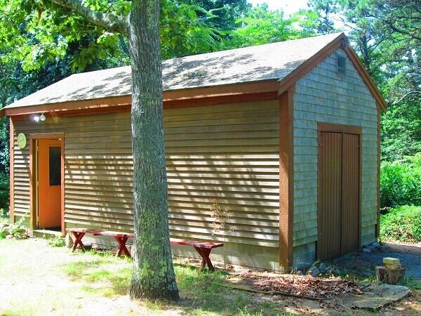 115 Pine Needle Road Wellfleet, MA 02667 - Photo 34 of 37 a front view of a house with garden