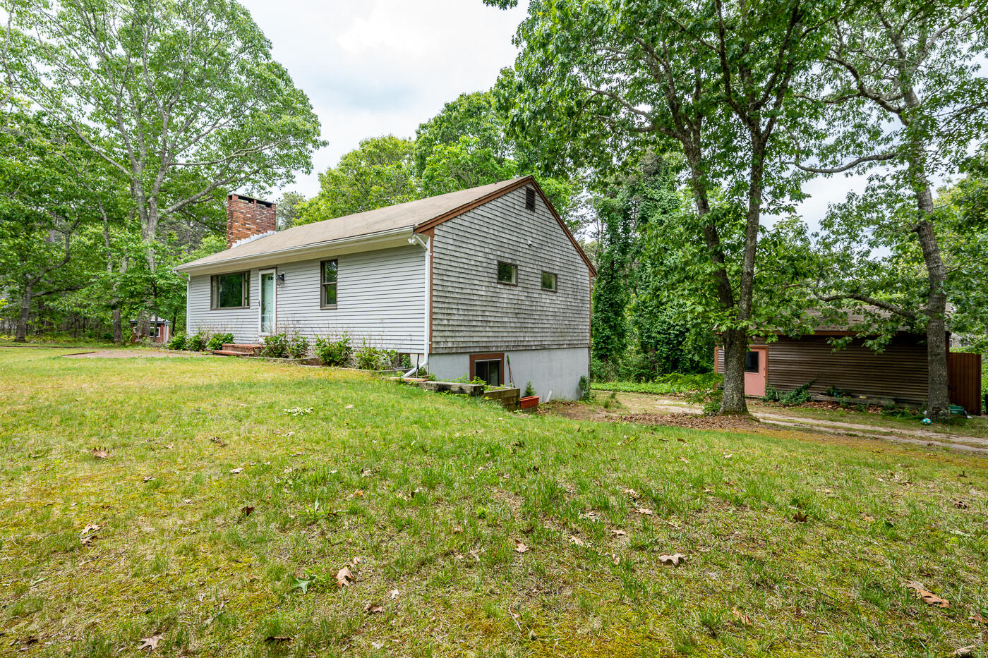115 Pine Needle Road Wellfleet, MA 02667 - Photo 36 of 37 a house view with a garden space
