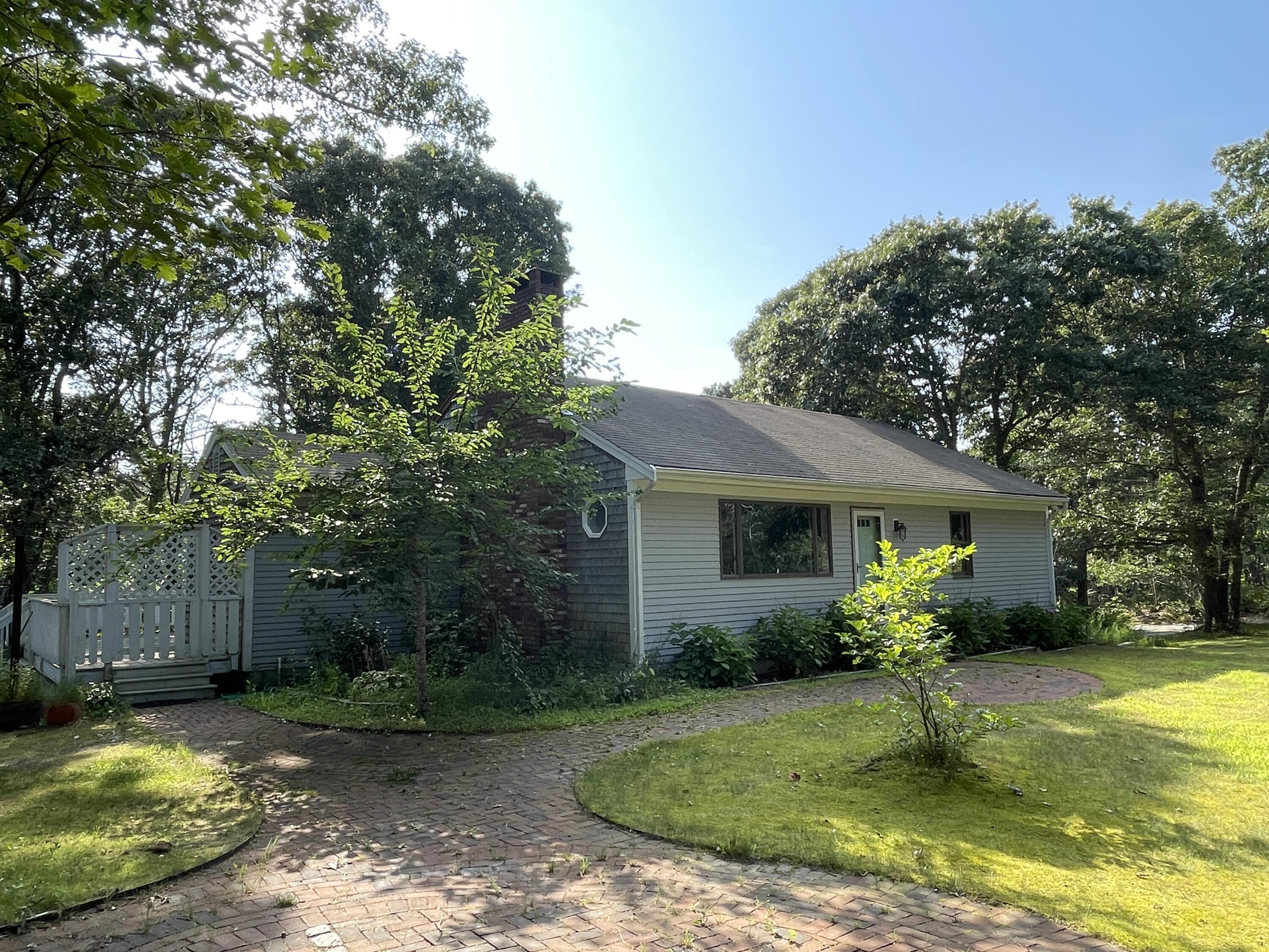 115 Pine Needle Road Wellfleet, MA 02667 - Photo 37 of 37 a view of a house with a yard and a garden