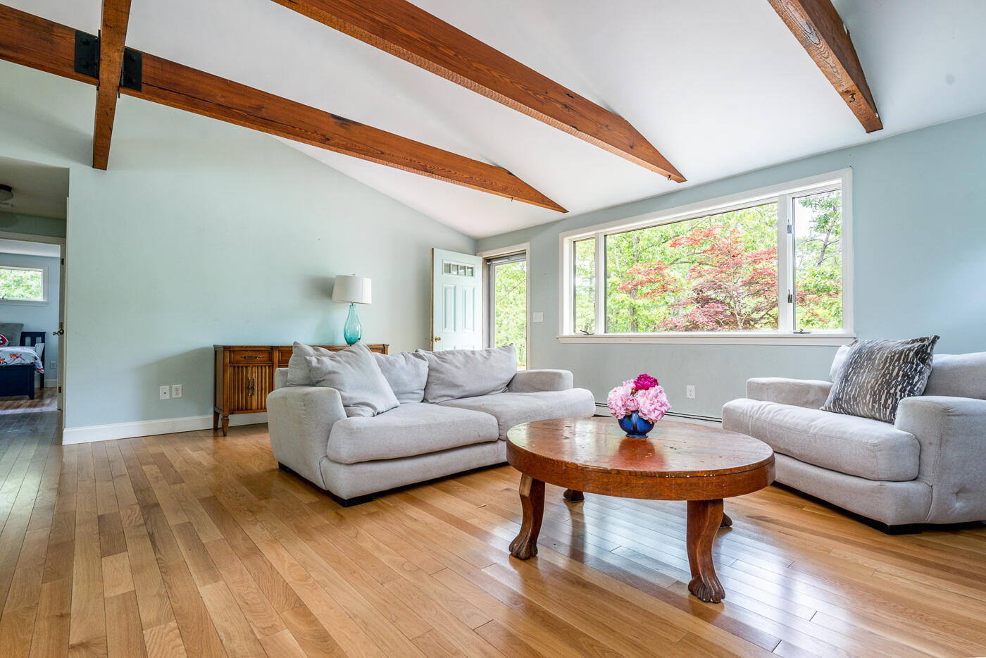 115 Pine Needle Road Wellfleet, MA 02667 - Photo 10 of 37 a living room with furniture and a large window