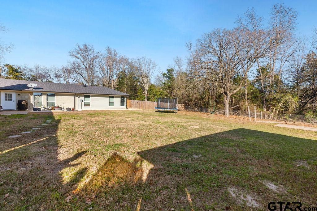 1102 Lilly Lane Bullard, TX 75757 - Photo 44 of 48 a swimming pool with trees in the background