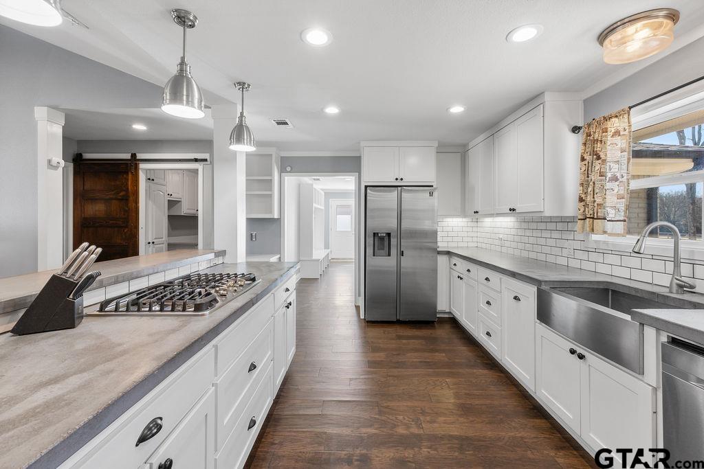 1102 Lilly Lane Bullard, TX 75757 - Photo 6 of 48 a large kitchen with stainless steel appliances granite countertop a sink stove and refrigerator