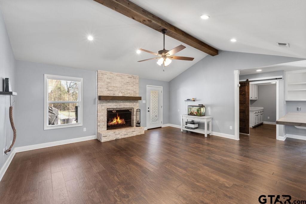 1102 Lilly Lane Bullard, TX 75757 - Photo 9 of 48 a view of an empty room with a fireplace and a window