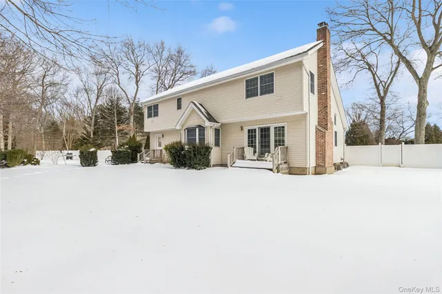 a view of a house with snow on the road