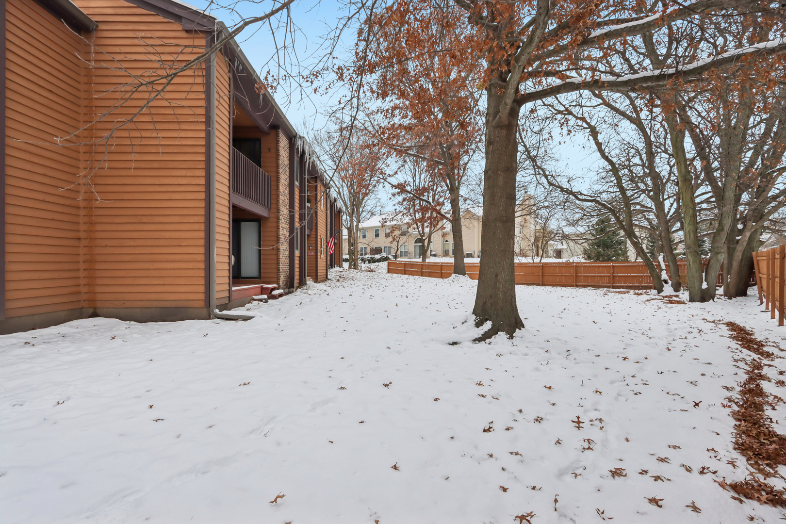 655 Waverly Drive, Unit C Elgin, IL 60120 - Photo 20 of 21 a street view with wooden fence