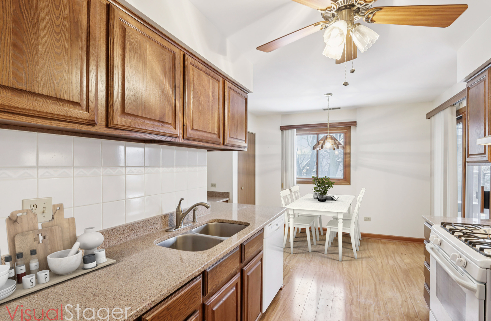 655 Waverly Drive, Unit C Elgin, IL 60120 - Photo 8 of 21 a kitchen with stainless steel appliances granite countertop a sink and cabinets
