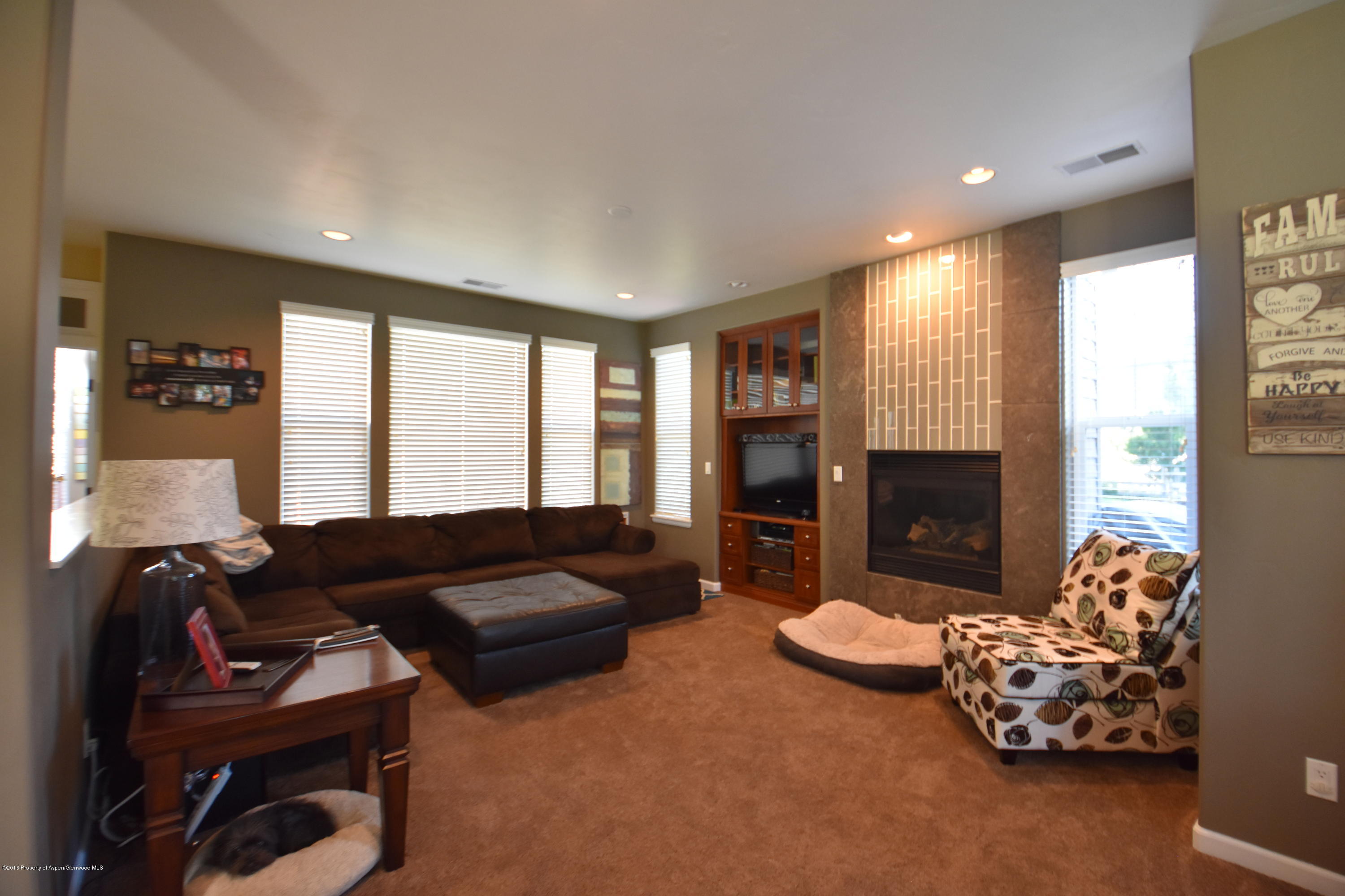 118 Carson Court New Castle, CO 81647 - Photo 11 of 26 a living room with furniture fireplace and flat screen tv