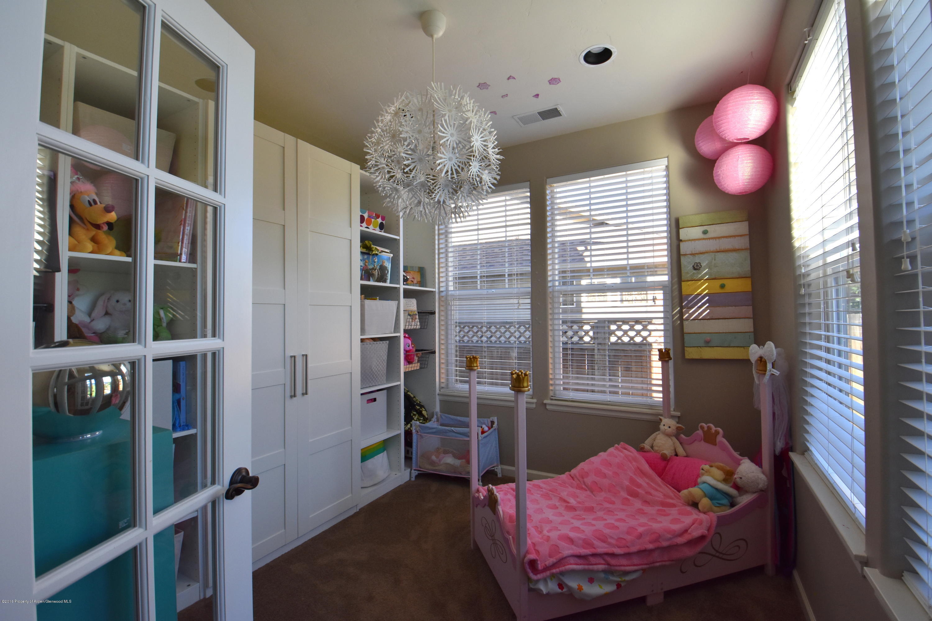 118 Carson Court New Castle, CO 81647 - Photo 15 of 26 a bed room with a bed and a window