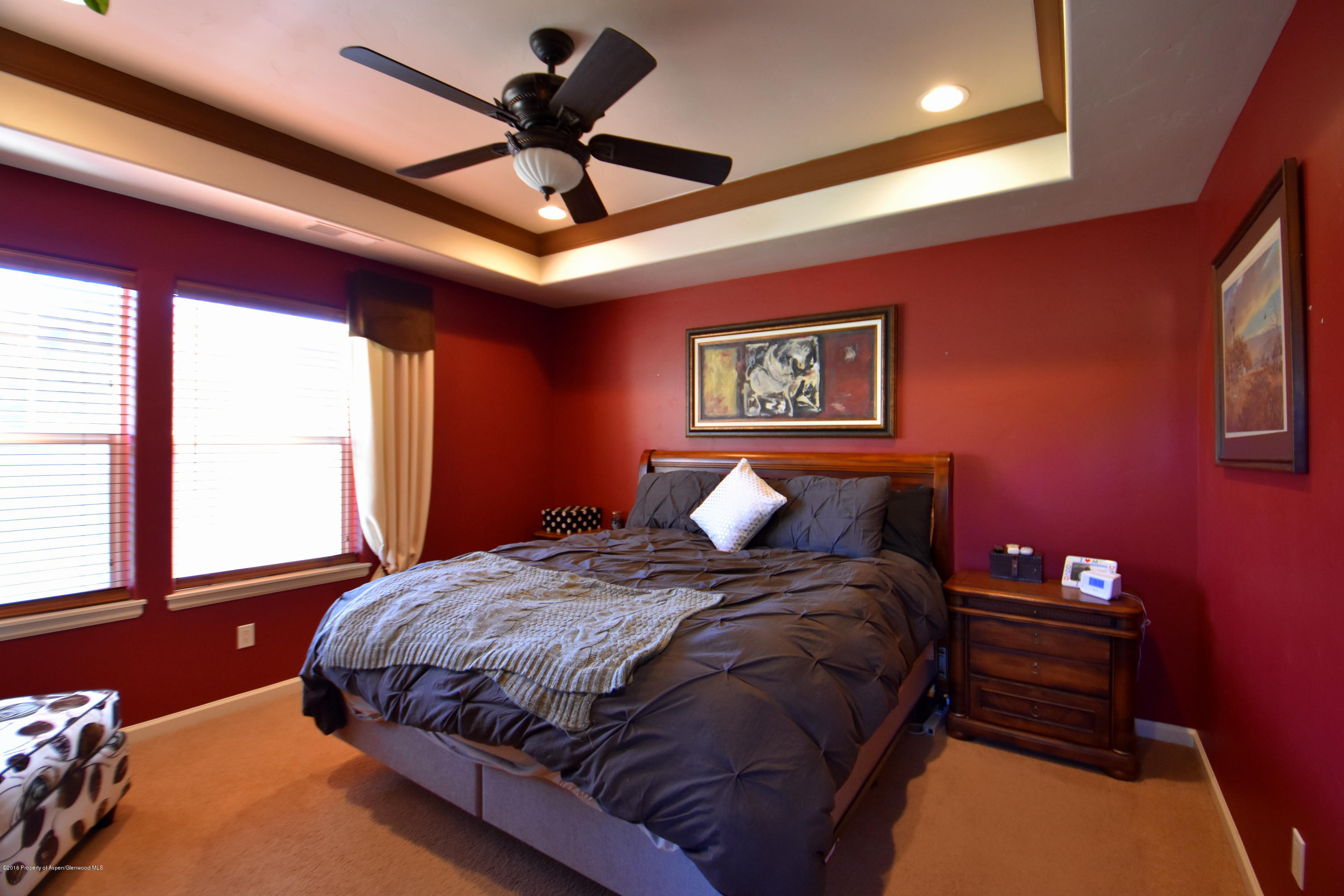 118 Carson Court New Castle, CO 81647 - Photo 17 of 26 a bedroom with a bed and a ceiling fan