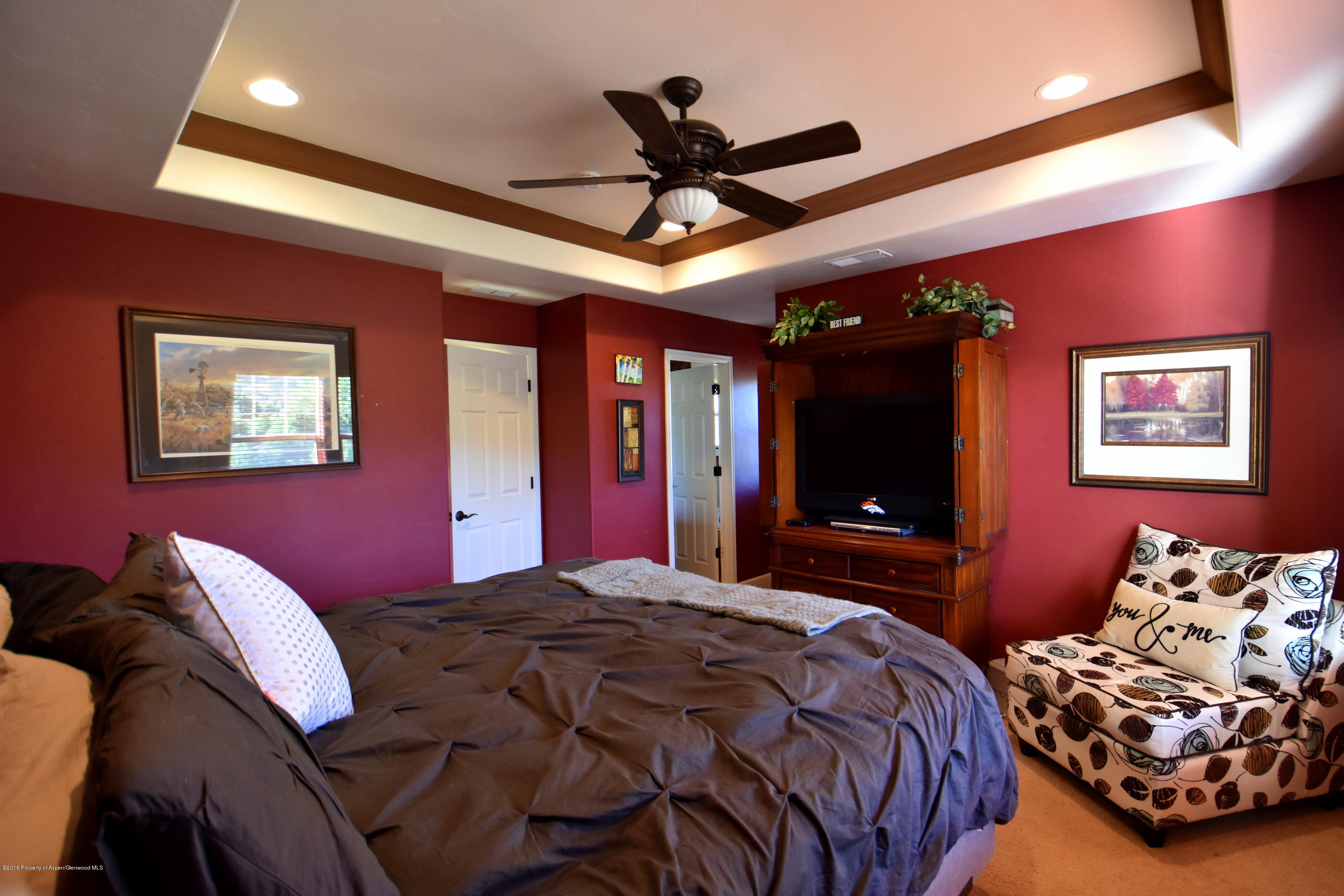 118 Carson Court New Castle, CO 81647 - Photo 18 of 26 a bedroom with bed and a flat screen tv