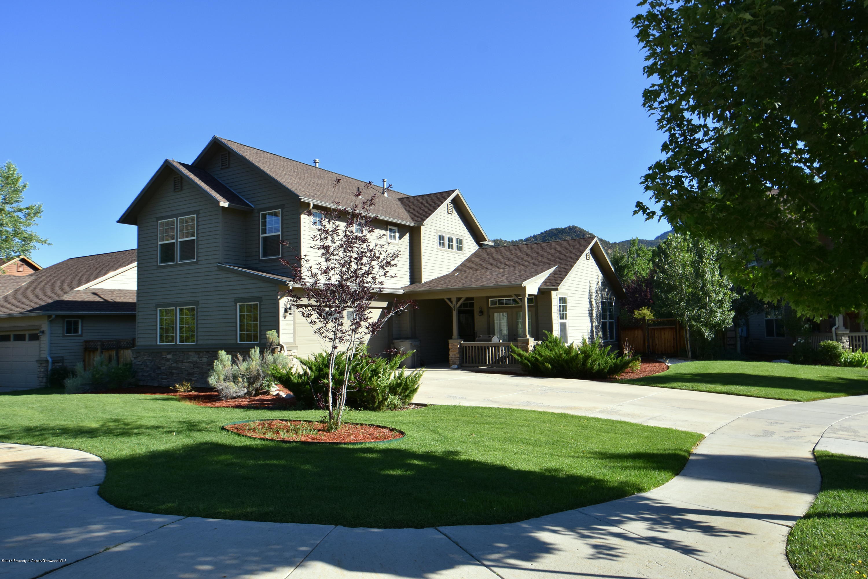 118 Carson Court New Castle, CO 81647 - Photo 2 of 26 a front view of a house with a yard