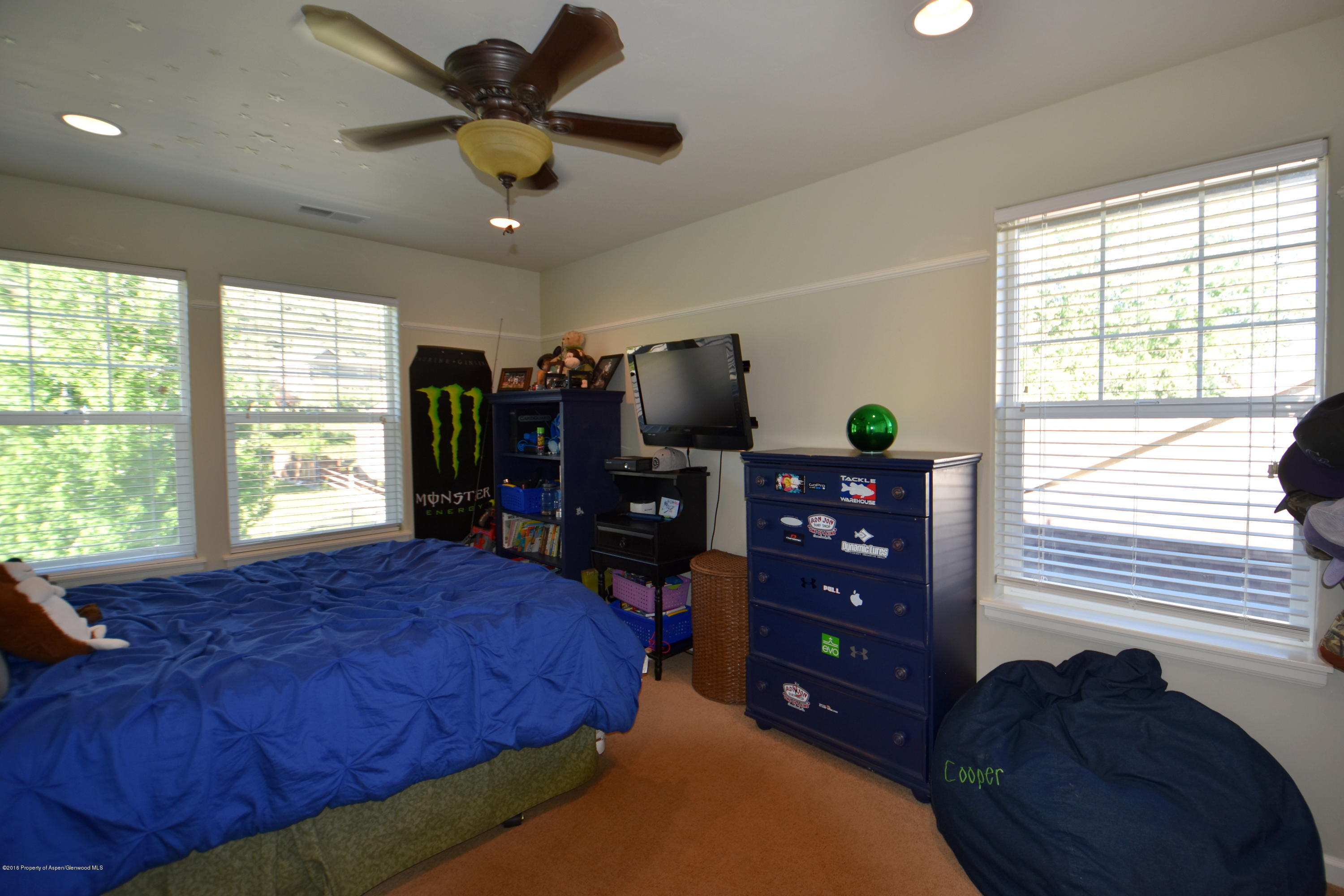 118 Carson Court New Castle, CO 81647 - Photo 22 of 26 a bed room with a bed and a television