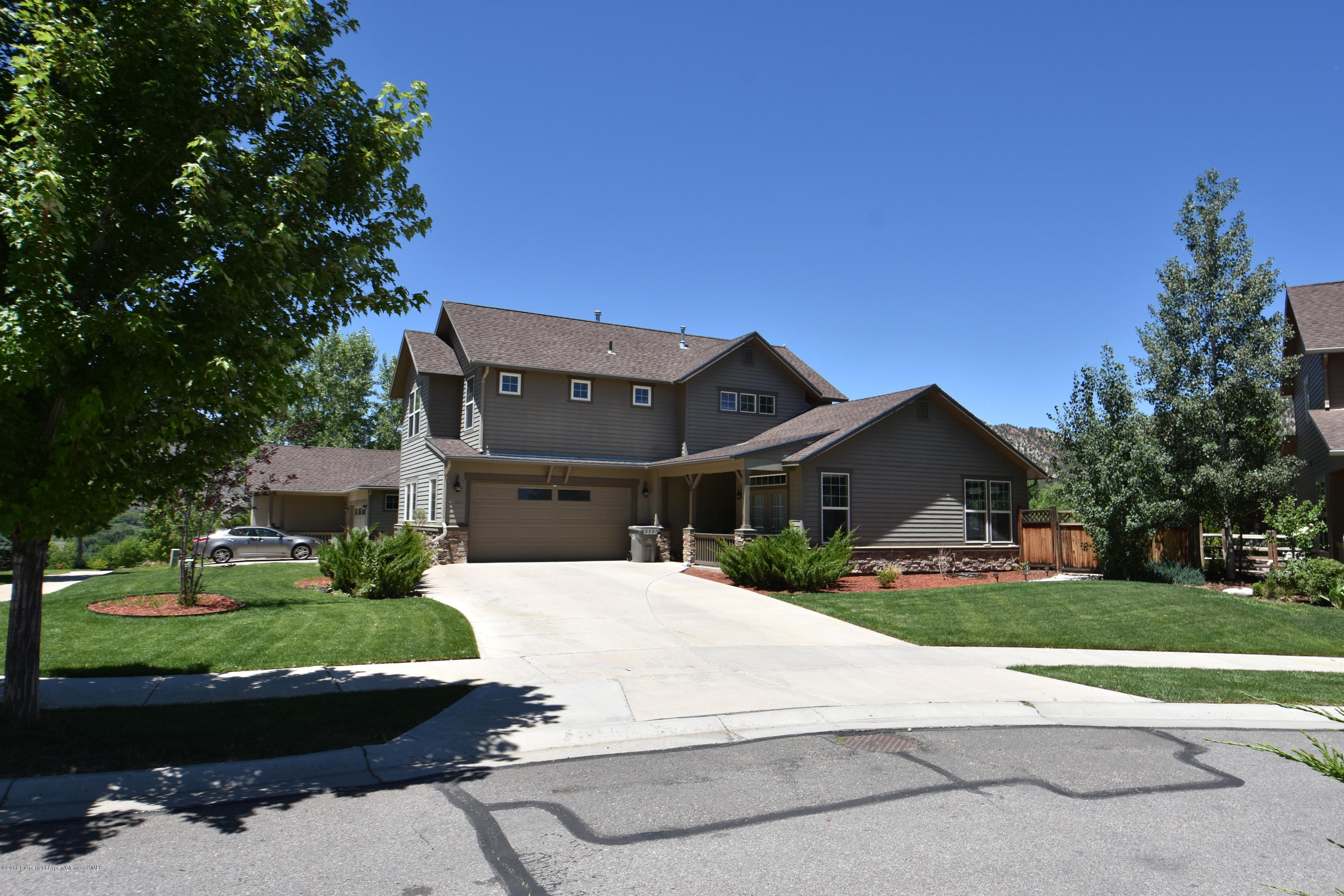 118 Carson Court New Castle, CO 81647 - Photo 26 of 26 a view of house with a yard and potted plants