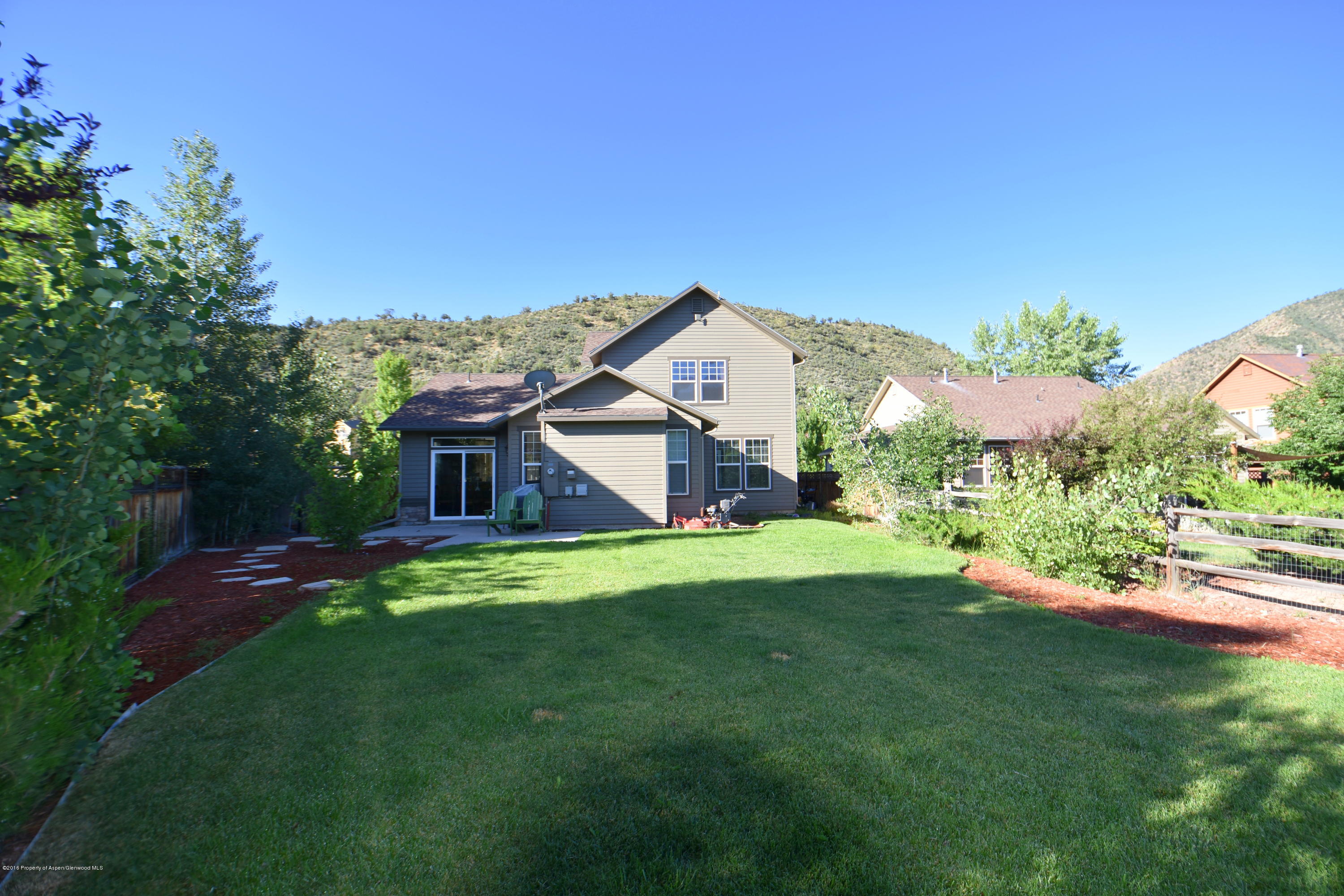118 Carson Court New Castle, CO 81647 - Photo 6 of 26 a view of a house with a big yard plants and large trees