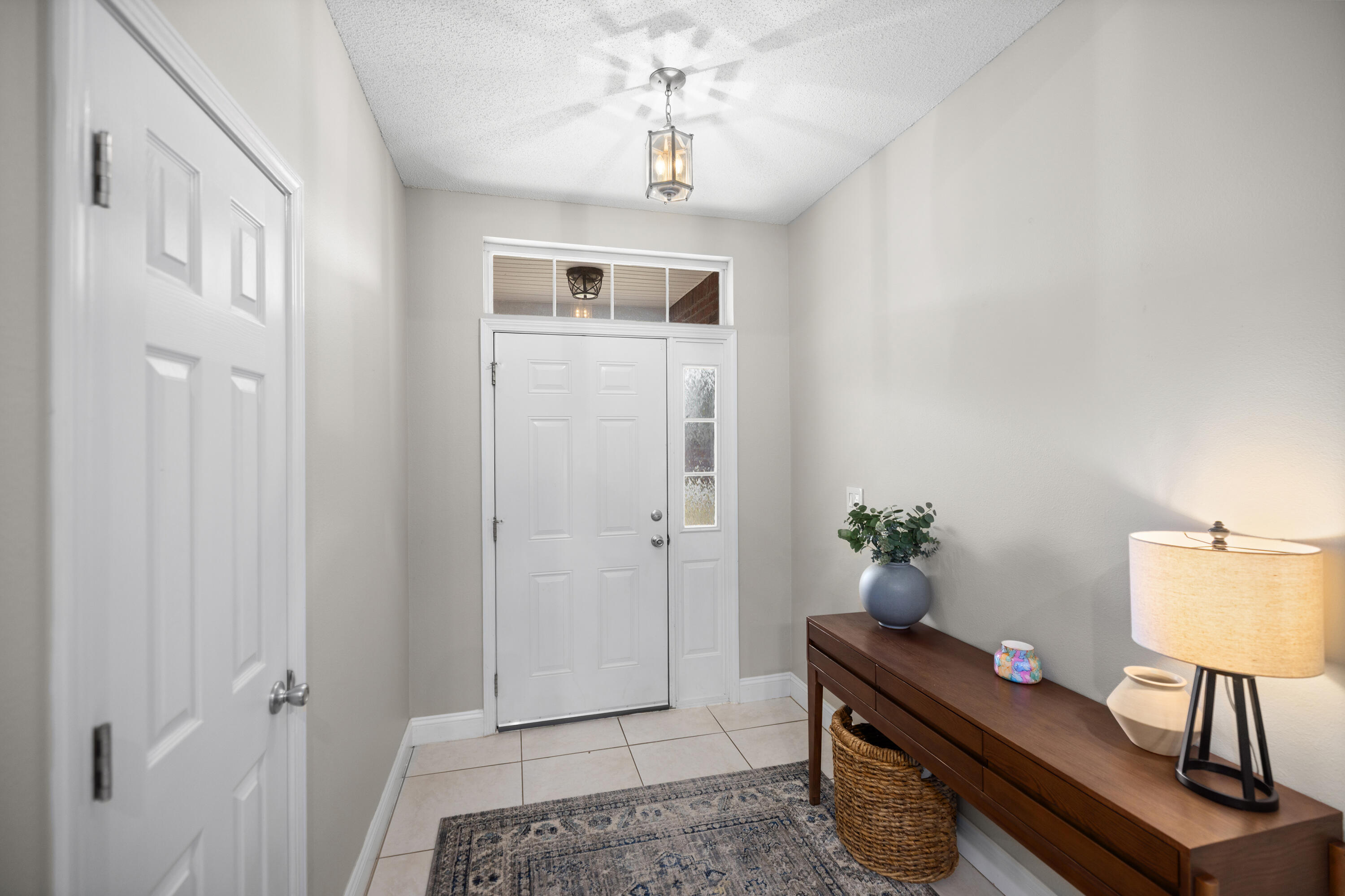 202 Limestone Circle Crestview, FL 32539 - Photo 6 of 49 a view of room with hardwood floor and cabinet