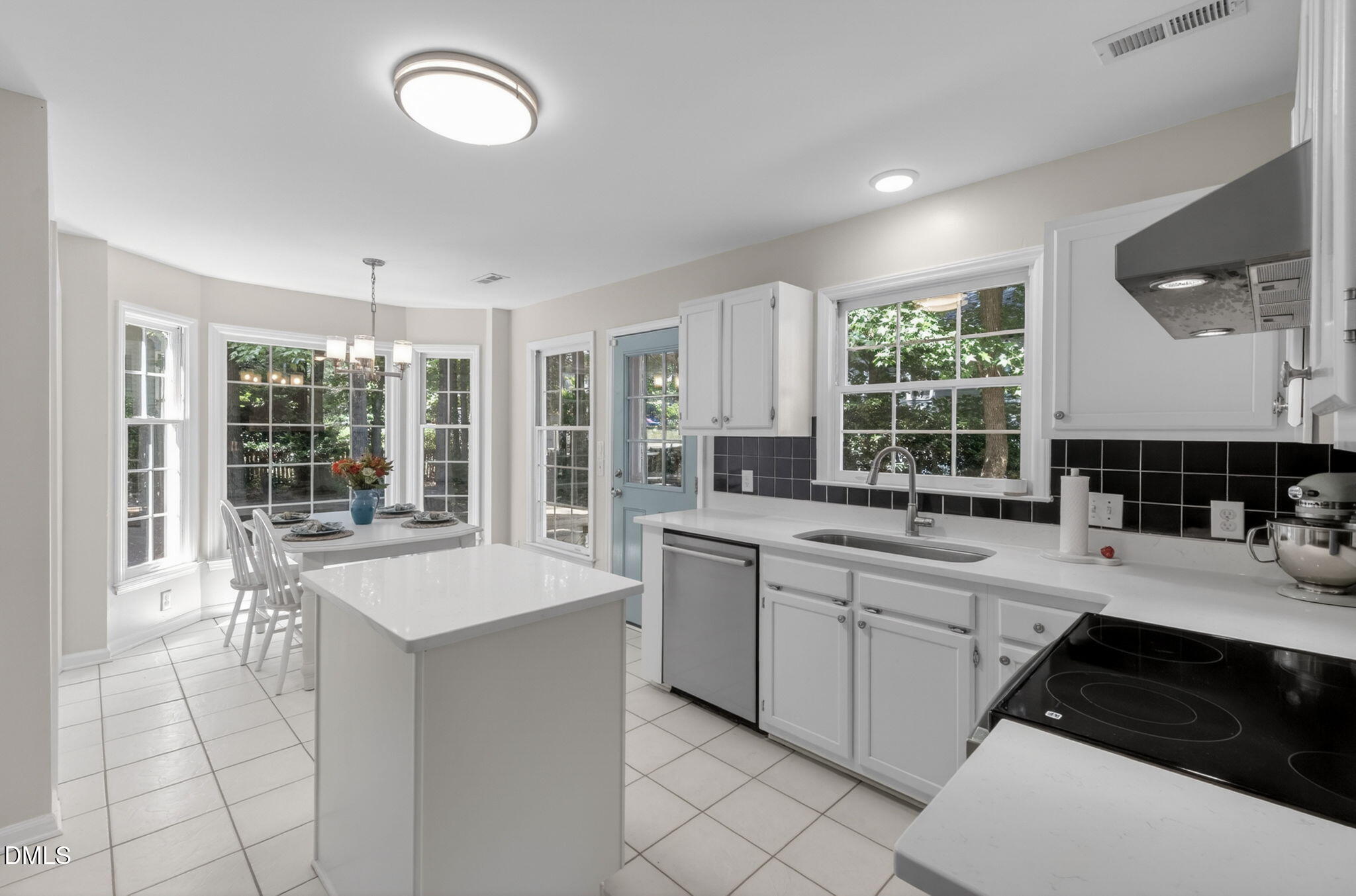 12113 Townmeade Court Raleigh, NC 27613 - Photo 14 of 39 New quartz countertops and freshly painted cabinets