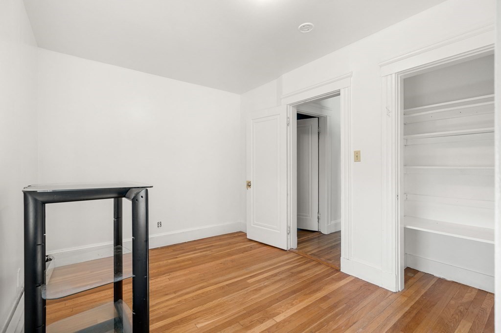 29 Harding Avenue Everett, MA 02149 - Photo 17 of 32 a view of an empty room with wooden floor and a window