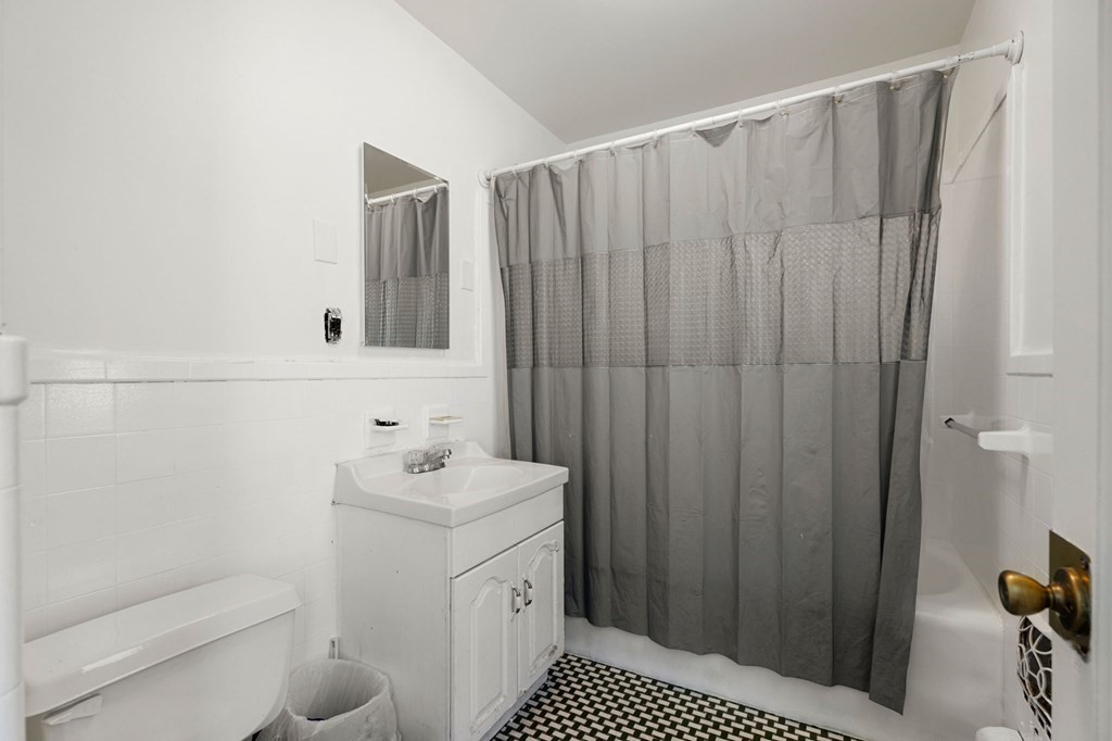 29 Harding Avenue Everett, MA 02149 - Photo 7 of 32 a bathroom with a sink a toilet and shower