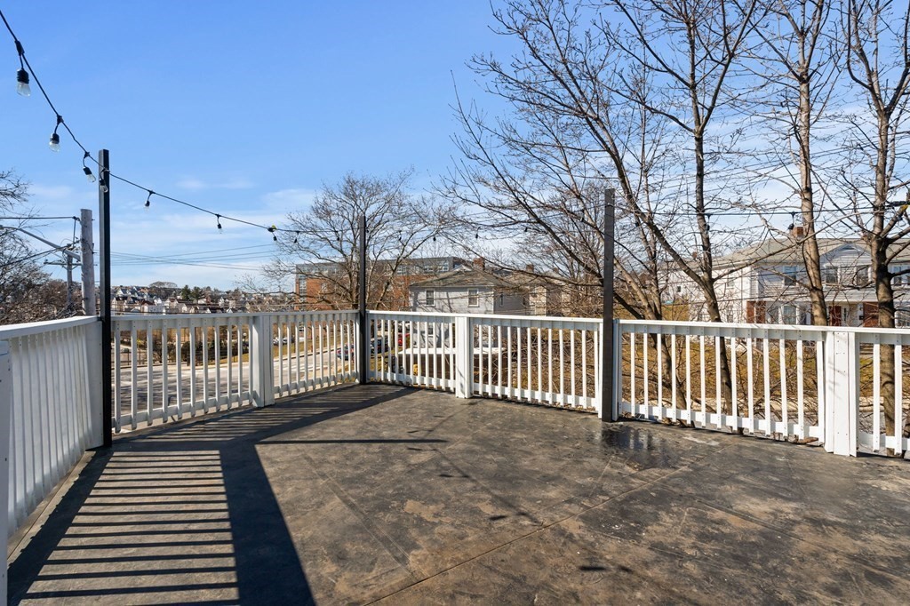 29 Harding Avenue Everett, MA 02149 - Photo 9 of 32 a view of a balcony with wooden fence