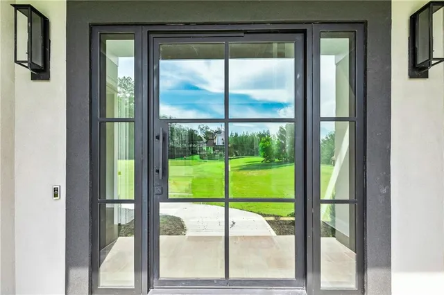 a view of a livingroom with wooden floor and a fireplace