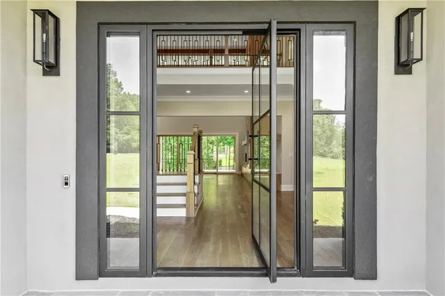 a view of kitchen with granite countertop window