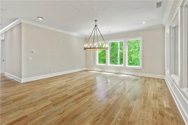 a view of a house with a ocean from a balcony