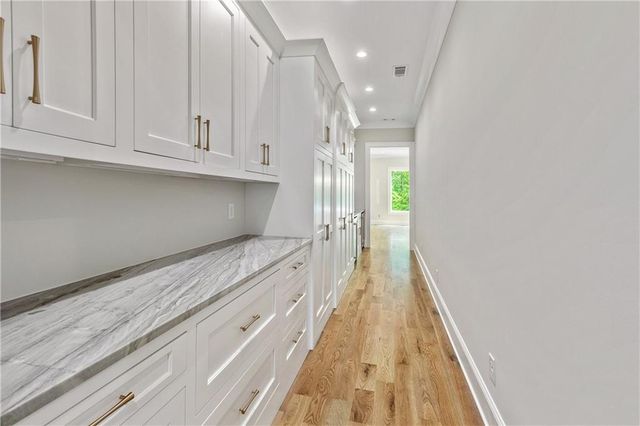 a white toilet next to a shower