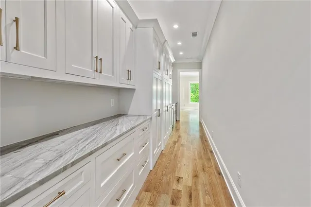 a white toilet next to a shower