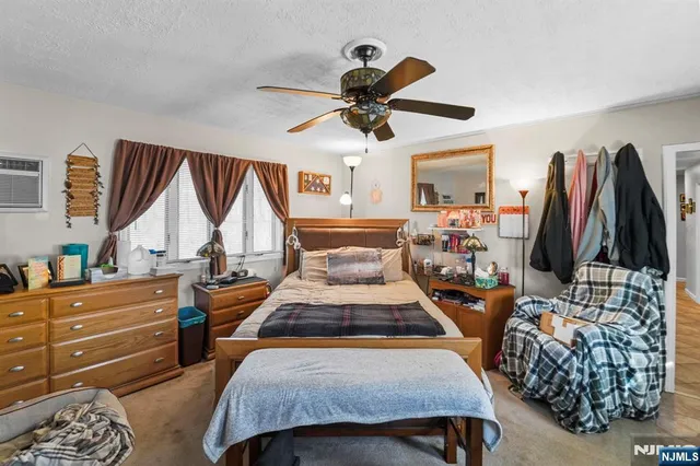 a bedroom with furniture and a window