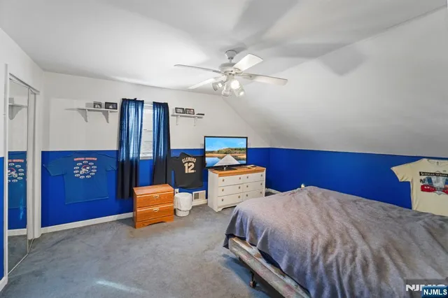 a bedroom with bed and window