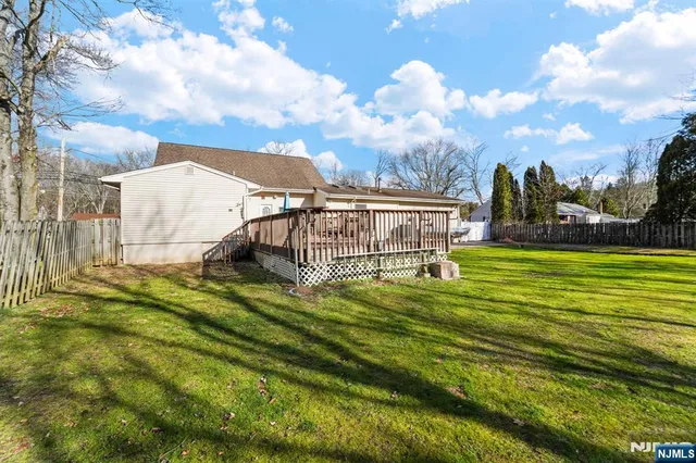 a view of a swimming pool with a garden and stairs