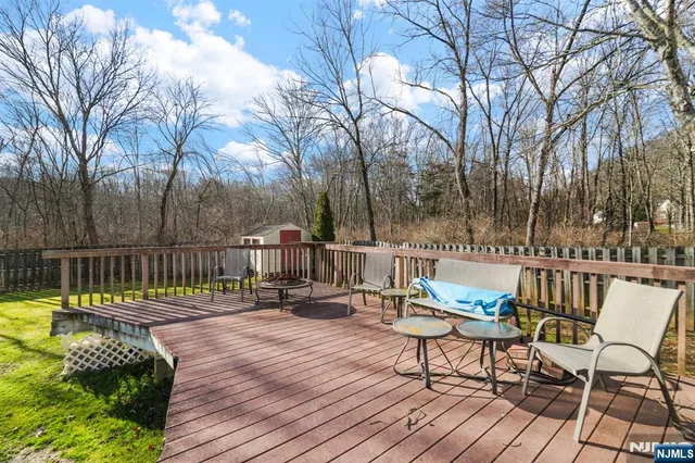 a view of chairs on deck with a barbeque
