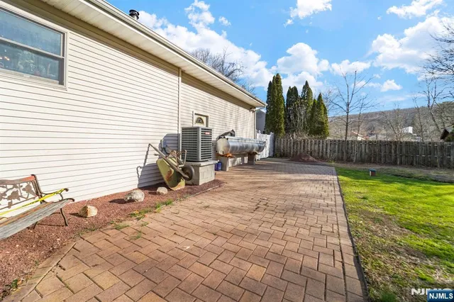 a view of a backyard with sitting area