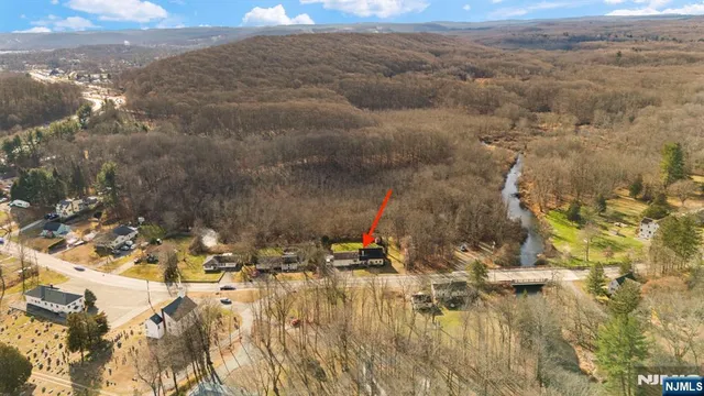 a view of swimming pool and mountain in the back