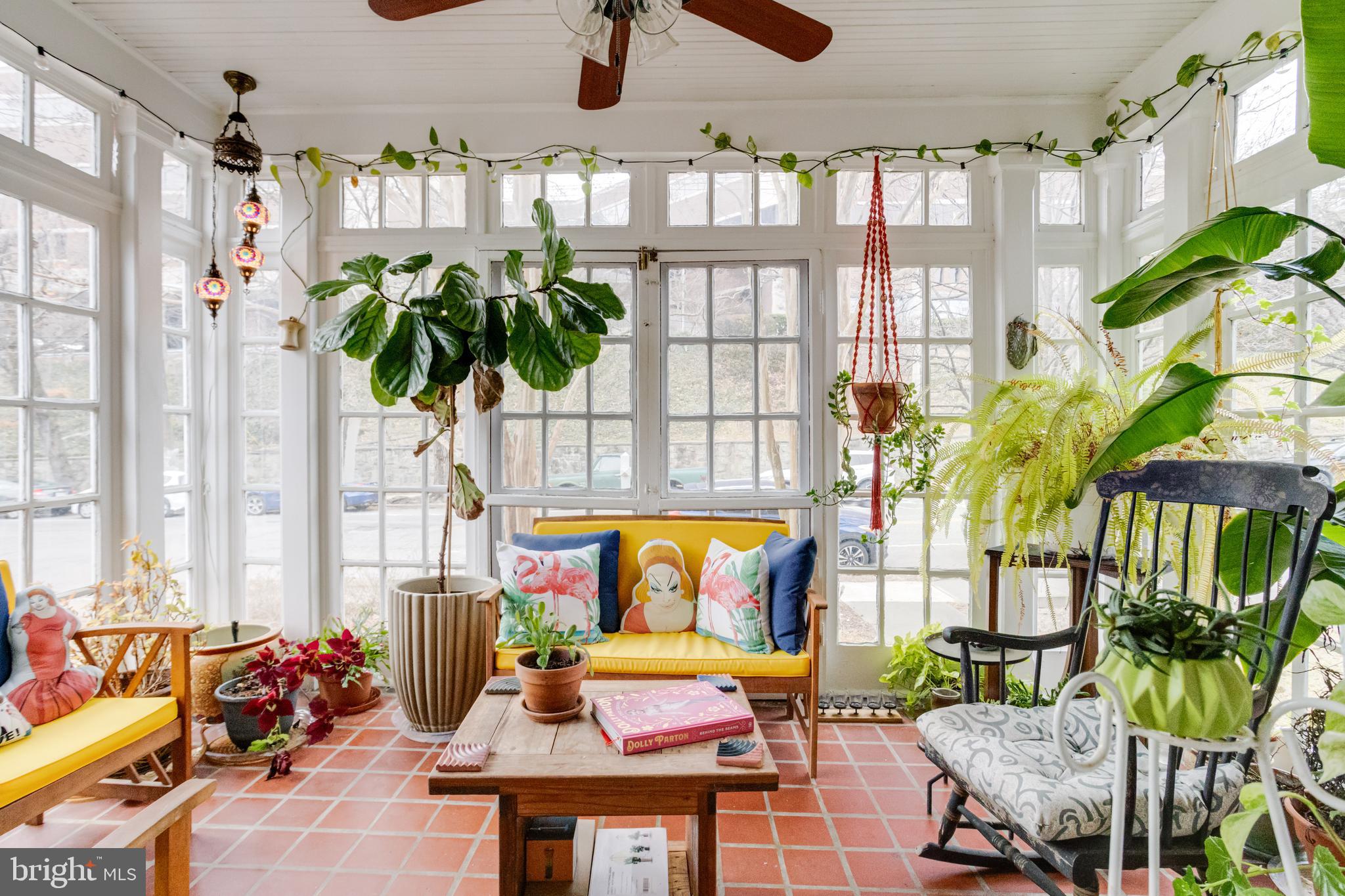 3901 Keswick Road Baltimore, MD 21211 - Photo 16 of 87 a living room filled with furniture and a potted plant